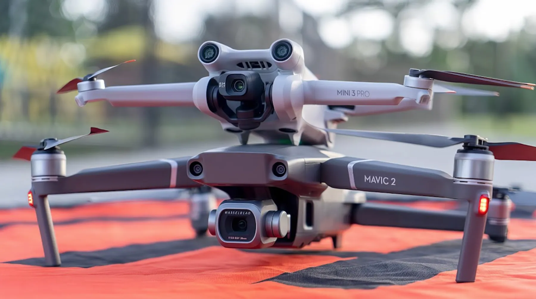 DJI Mavic and Mini drones laid out before a volcano photography flight